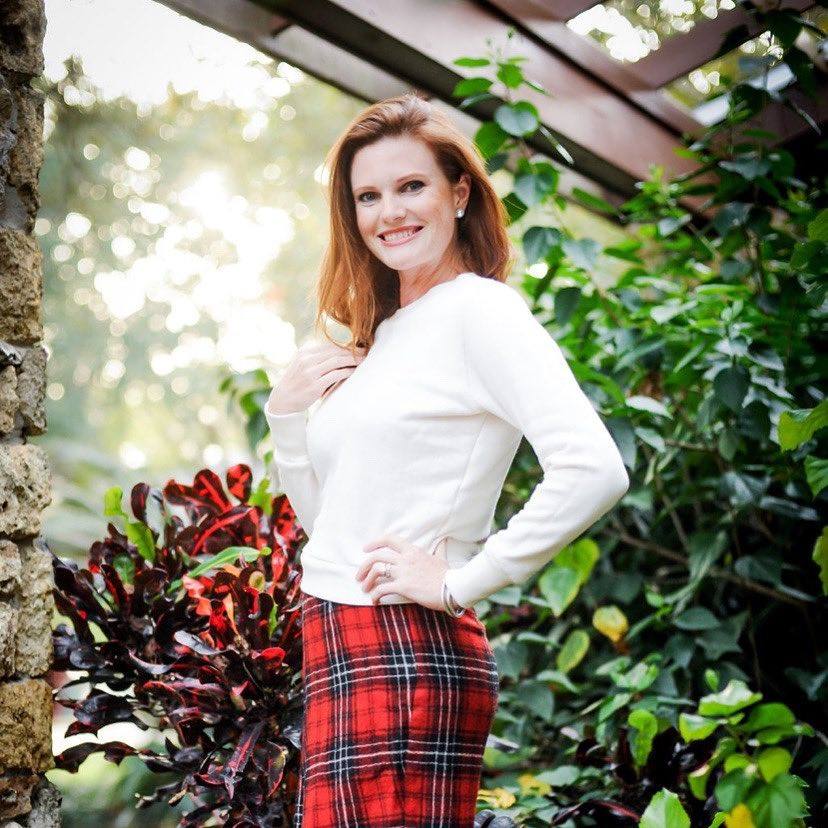 Red headed women dressed in plaid for the holidays.  Plaid skirt, plaid style.