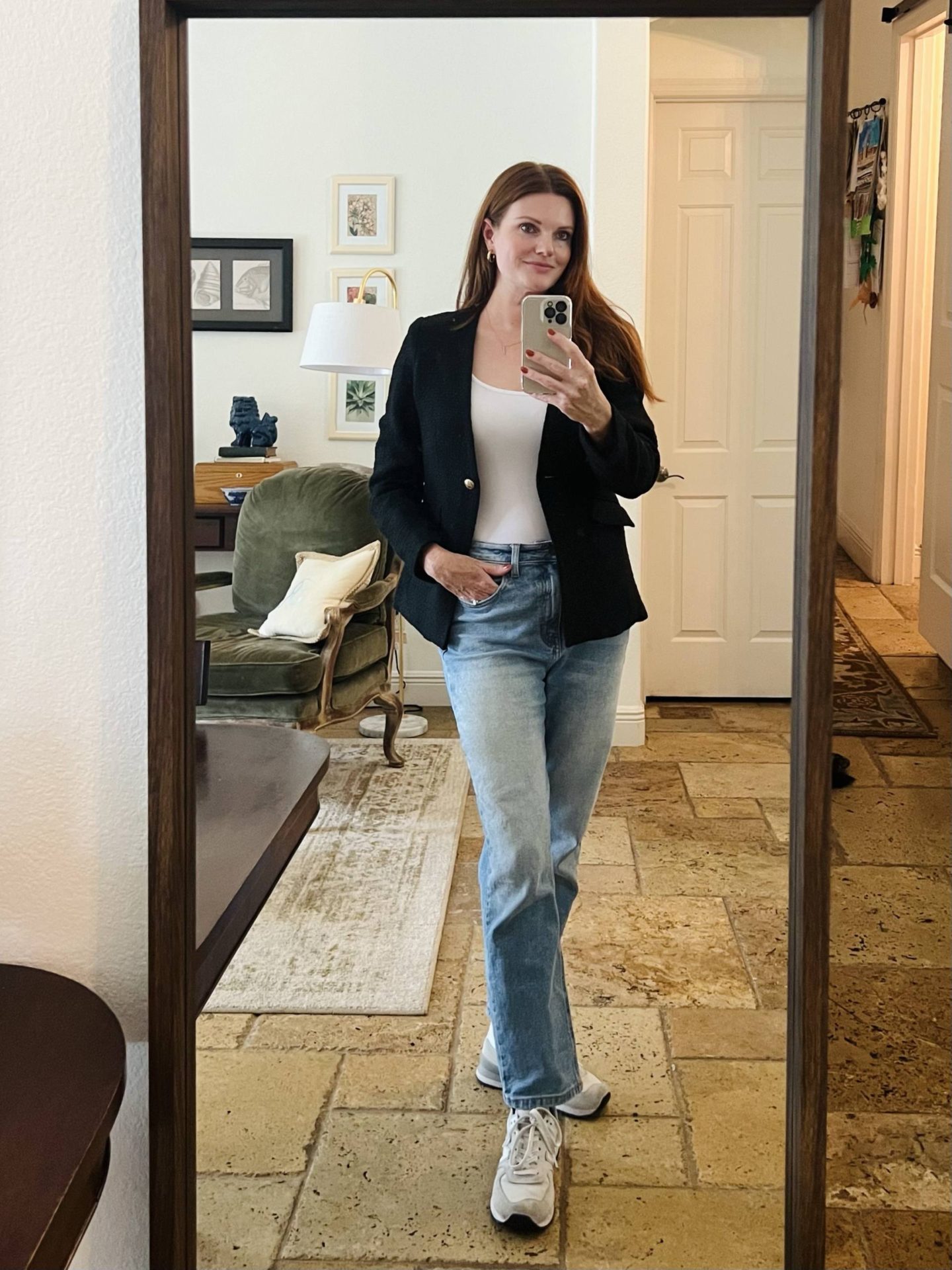 Cute and comfy shopping outfit featuring a black blazer, relaxed/boyfriend jeans, a white bodysuit, and white sneakers.